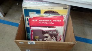 A box of Elvis 45rpm and LP records