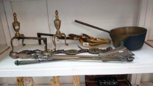 A mixed lot of Victorian brass ware including fire irons, fire dogs, saucepan,