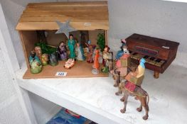 A toy piano and a Nativity scene