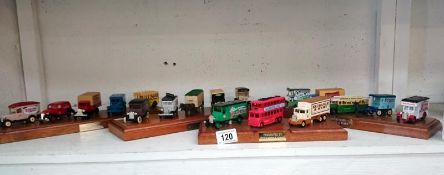 A quantity of Lledo model cars mounted on bases
