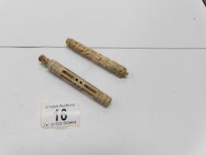 2 carved bone needle cases