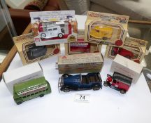 A boxed Triang Minic Vauxhall tourer and a quantity of Lledo models
