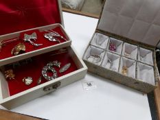 2 jewellery boxes containing approximately 22 costume brooches