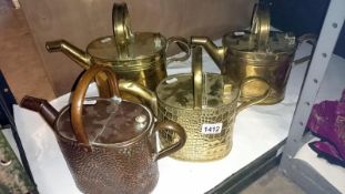4 Late Victorian brass and copper hot water cans