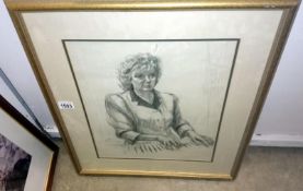 A pencil study of a woman at piano initialed J N 1989