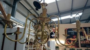 A polished brass 6 lamp ceiling light