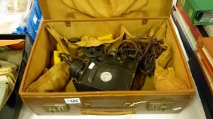 A Mickey Mouse safe toy cinema projector in leather suitcase