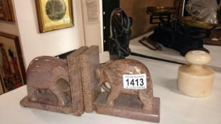 A pair of marble pink elephant book ends,