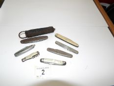 A quantity of vintage pocket knives including advertising