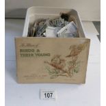 A box of cigarette and tea cards