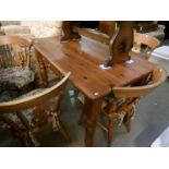 A pine kitchen table and 5 chairs