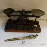 A set of old postal scales and a life boat man paperknife