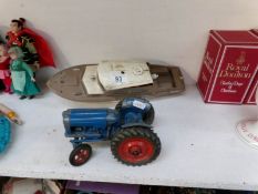 A Chad Valley Fordson tractor and a 'Derwent' battery operated boat a/f