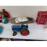 A Chad Valley Fordson tractor and a 'Derwent' battery operated boat a/f