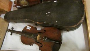 A cased violin and bow,