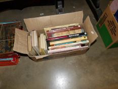 A box of book relating to dolls etc