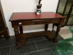 A Victorian leather top writing table