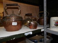 3  copper kettles and a brass kettle