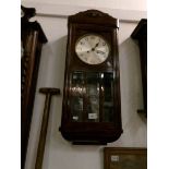 A 1930's oak wall clock
