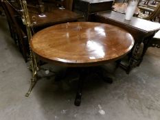 An oval mahogany inlaid loo table