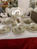 A 4 place setting lustre tea set including sugar bowl,