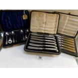 A cased set of silver handled butter knives and 2 other cased sets of cutlery