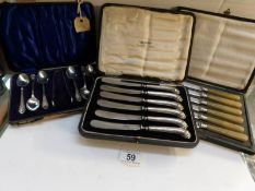 A cased set of silver handled butter knives and 2 other cased sets of cutlery