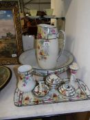 A jug and basin set with matching trinket set