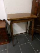 A mahogany inlaid fold over card table