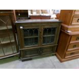 An oak lead glazed bookcase