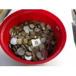 A tin of mixed UK and foreign coins