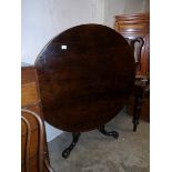 A Victorian rosewood tip top table