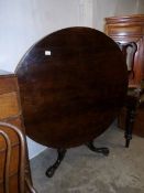 A Victorian rosewood tip top table