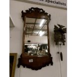 An early Victorian mahogany wall mirror