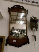 An early Victorian mahogany wall mirror