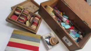 An old cigar box containing gaming chips, bone dominoes,