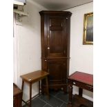 An oak corner cupboard