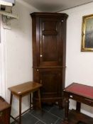 An oak corner cupboard