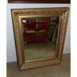 A gilt framed mirror