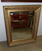 A gilt framed mirror