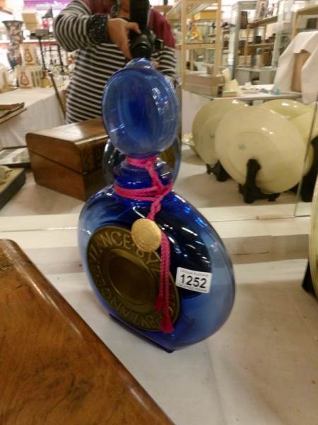 A large Byzance blue glass shop display scent bottle