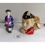 A Royal Doulton character jug 'Drummer Boy' and a Royal Doulton figurine 'Boy from Williamsburg'