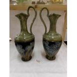 A pair of Doulton stoneware ewers,
