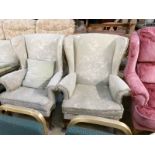 A pair of wing armchairs