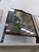 An oak fire screen with print of Bubbles