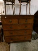 An oak 2 over 3 chest of drawers