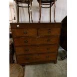 An oak 2 over 3 chest of drawers