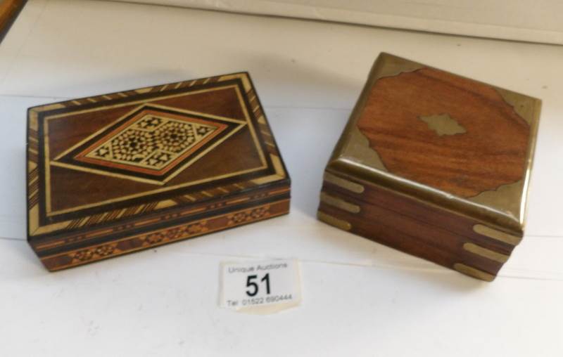 An inlaid wooden box and one other