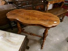 A figured mahogany occasional table