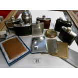 A mixed lot of hip flasks and cigarette lighters